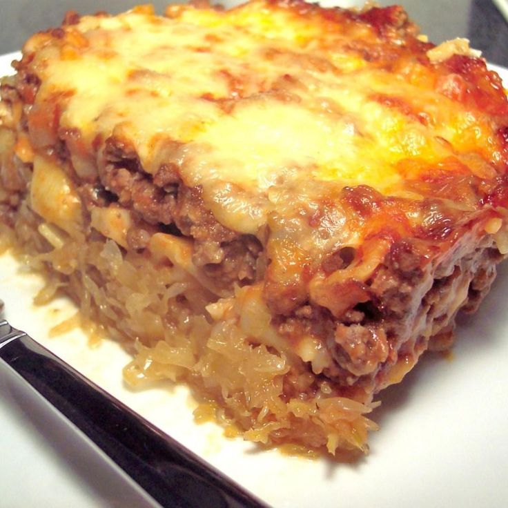 a slice of lasagna on a plate with a fork