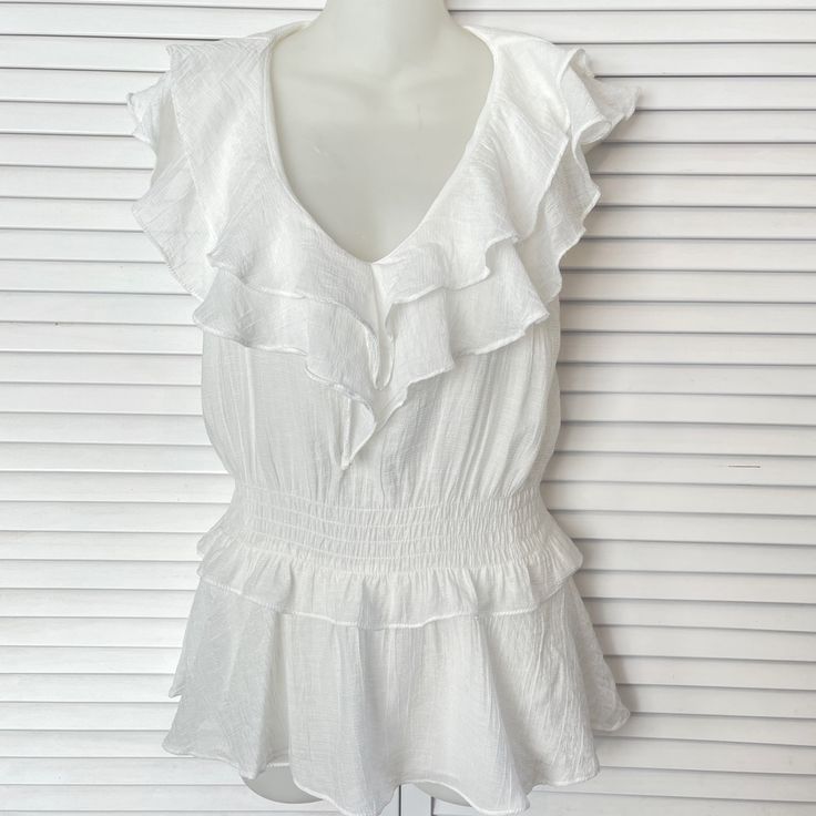 Dreamy Sleeveless Ruffled White Pullover Blouse By Do+Be. Nwot. Crisp White Polyester Gauze Fabric. Polyester Lining. No Stains, No Flaws. Excellent Condition! Elastic Waist. Size Xs. Machine Washable. Measurements: Pit To Pit 17” Elastic Waist Adjusts From 26-32” (Depending On Stretch) Hip 36” Back Length 26” Summer Tops With Flutter Sleeve And Ruffle Hem, Feminine Sleeveless Peplum Top For Day Out, Sleeveless Peplum Top With Ruffle Hem, Sleeveless Ruffle Hem Peplum Top For Day Out, White Top With Ruffled Hem And Straps, Chic Sleeveless Blouse With Ruffle Hem, Sleeveless Summer Peplum Top For Day Out, Summer Blouse With Ruffles And Flutter Sleeves, Sleeveless Summer Peplum Top