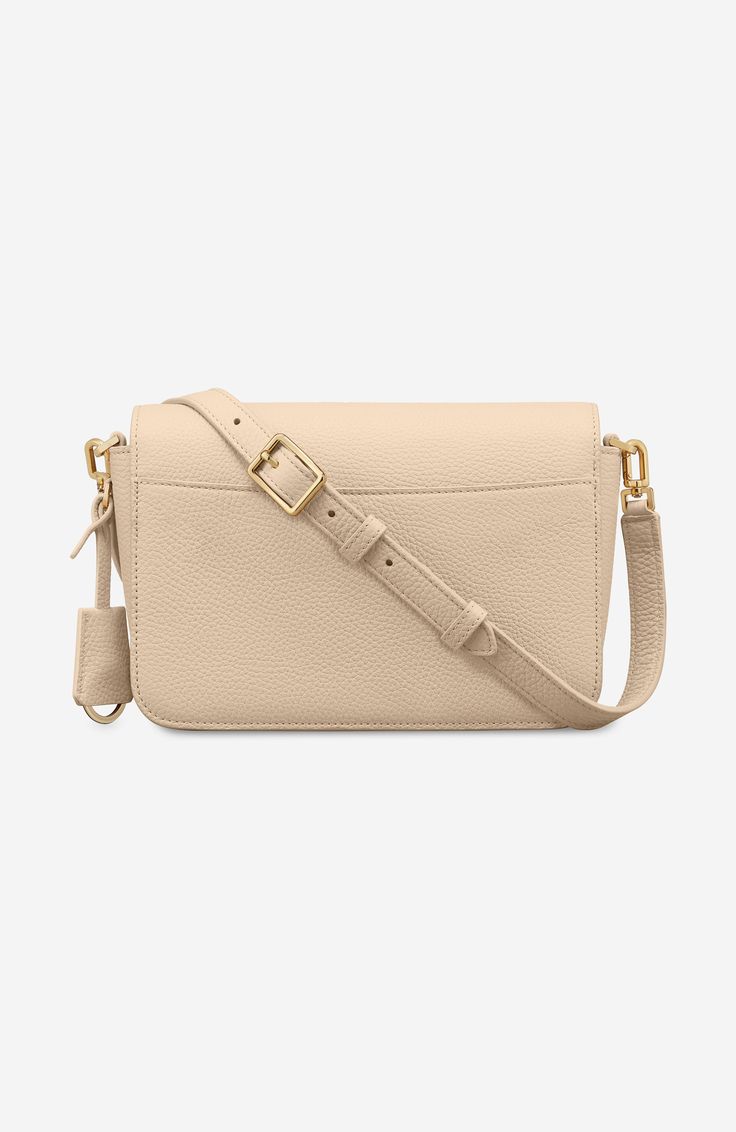 Meet your everyday go-to handbag. The Medium Flap Bag reimagines The Mini Flap Bag, our cult carryall, with more space without compromising its signature boxy silhouette. Crafted from buttery full-grain European leather, the design features three internal compartments for enhanced on-the-go organisation of each of your MAISON de SABRÉ pieces. Style it your way with two adjustable straps made for under-arm or crossbody carry while a secure magnetic flap ensures your keys, wallet, cards, cosmetics Designer Everyday Flap Bag With Removable Pouch, Designer Flap Bag With Removable Pouch For Everyday, Luxury Rectangular Flap Bag For Everyday, Luxury Rectangular Flap Bag For On-the-go, Elegant Everyday Crossbody Bag, Luxury Everyday Flap Bag With Removable Pouch, Rectangular Bag With Detachable Strap For Daily Use, Everyday Rectangular Bag With Detachable Strap, Rectangular Satchel With Adjustable Strap For Everyday