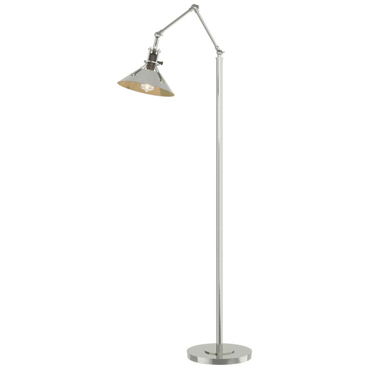 a lamp that is on top of a metal pole with a white light behind it