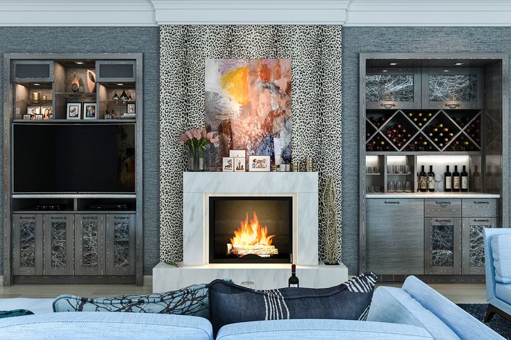 a living room filled with furniture and a fire place in front of a tv mounted on a wall