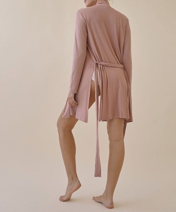 Wrap yourself in luxury with our BAMBOO robe cardigan. Crafted from the finest materials, this cardigan provides a soft, silky feel against your skin. Perfect for lounging at home or layering over your favorite yoga outfit, Elevate your style and indulge in the luxurious benefits of our BAMBOO robe cardigan. PRODUCT DETAILS Activity: Yoga, lounge, studio-to-street Feel: Soft, weightless moveable feel FABRIC & CARE 95% Organic Bamboo, 5% Spandex Sustainable & thermoregulating non-sheer, breathabl Relaxed Fit Long Sleeve Lounging Robe, Oversized Long Sleeve Robe For Lounging, Chic Long Sleeve Loungewear Robe, Soft Long Sleeve Sleepwear, Long Sleeve Relaxed Fit Robe For Fall, Spring Wrap Loungewear Robe, Spring V-neck Robe For Loungewear, Long Sleeve Robe For Lounging, Spring Lounging Wrap Sleepwear