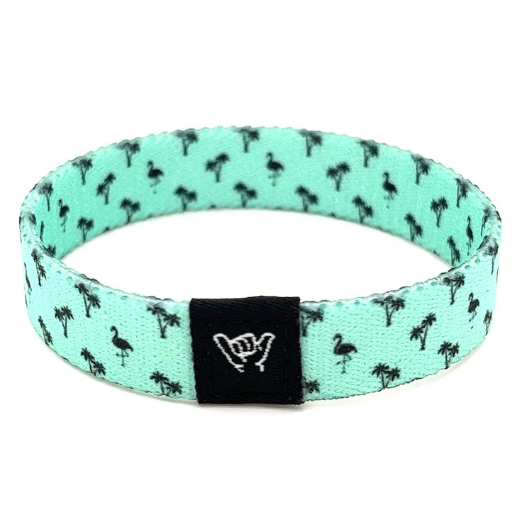 "Flaunt your preppy style with this mint green flamingo band. Match it with your favorite colored shorts and head over to the beach!  Available sizes:  Extra Small 5.5\" (petites + kids) Small 6.5\" (most common fitting size) Medium 7.5\" (large wrists) Large or Anklet 8.5\" (very large wrists or anklet) 1/2\" Width Reversible surf and beachy prints. Elastic blend material, can stretch to desired fit. Packaged in natural drawstring gift pouches. Machine washable. Chlorine and saltwater safe." Casual Adjustable Wristband, Playful Summer Bracelets For Vacation, Playful Summer Vacation Bracelets, Adjustable Trendy Wristband For Beach, Adjustable Turquoise Bracelet For Summer, Adjustable Turquoise Bracelets For Summer, Adjustable Casual Wristband, Green Bracelets For Beach In Spring, Green Bracelets For Beach Spring Season