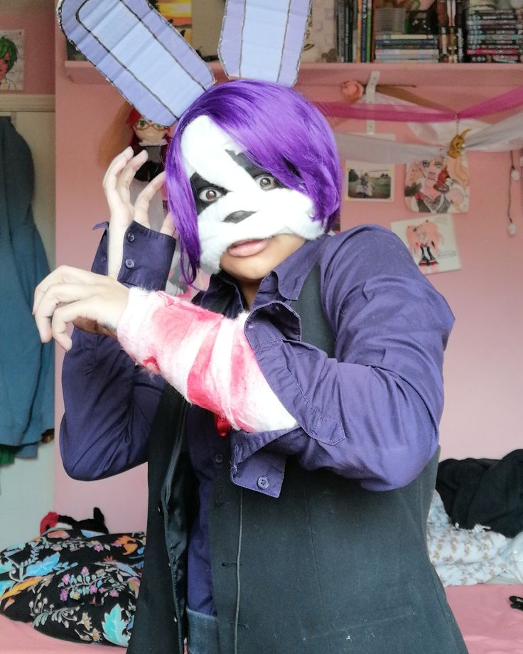 a person with purple hair and bunny ears