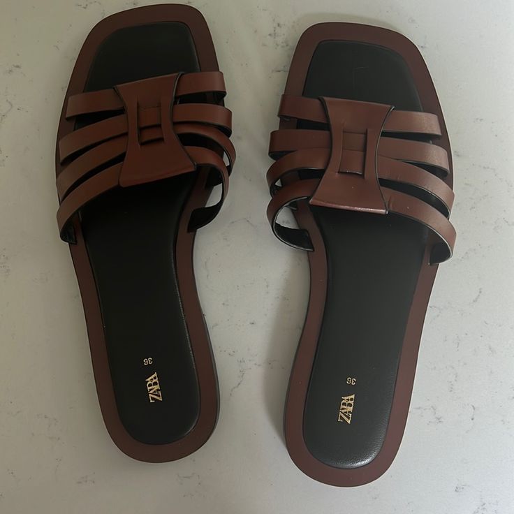 Brand New Zara Sandals Brown With Black Cushion Bottom Size 36 Brown Flat Sandals For Vacation, Brown Flat Heel Sandals For Vacation, Casual Brown Flat Sandals, Chic Brown Sandals With Flat Heel, Chic Brown Flat Heel Sandals, Brown Flat Heel Mules For Beach, Brown Flat Sandals With Buckle Closure, Brown Flat Mules For The Beach, Chic Brown Mules For Beach