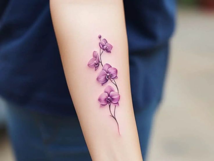 a woman's arm with purple flowers on it