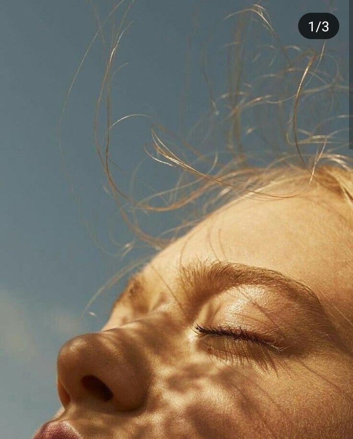 a close up of a person with their eyes closed