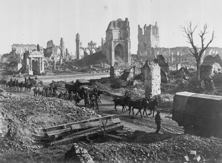 an old black and white photo of people on horses in the middle of a destroyed city