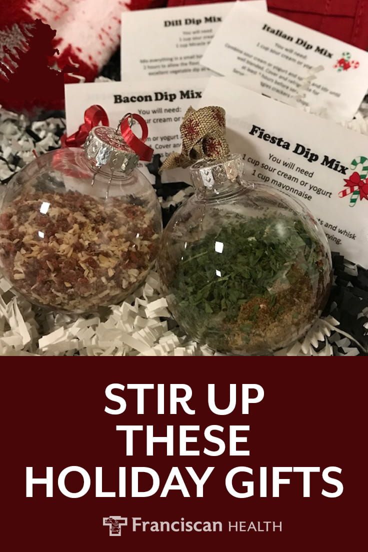 three christmas ornaments with the words stir up these holiday gifts on them and in front of it