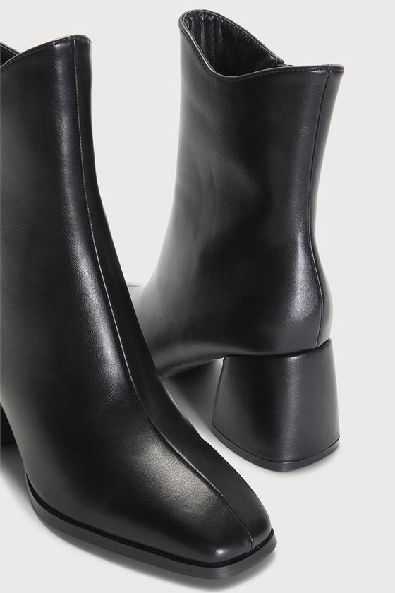 The Lulus Windal Black Square Toe Mid-Calf Boots is ready to make every 'fit a chic moment this season! Smooth faux leather shapes a squared-off toe that meets a 7"" mid-calf shaft with a 10"" circumference and a curved topline. A 6"" zipper at the instep and a chunky block heel complete the look! 2. 75" wrapped block heel. Cushioned insole. Rubber sole has nonskid markings. ALL MAN MADE MATERIALS. Imported. Lulus | Windal Black Square Toe Mid-Calf High Heel Boots | Size 6. Leather Knee-high Boots With Square Toe, Modern Square Toe Boots With Medium Width, Spring Square Toe Knee-high Faux Leather Boots, Classic Heeled Boots With Square Toe And Padded Heel, Classic Heeled Boots With Padded Heel And Square Toe, Wide Calf Boots With Sculpted Heel And Square Toe, Wide Calf Boots With Padded Heel And Square Toe, Square Toe Platform Boots For Formal Fall Events, Formal Fall Platform Boots With Square Toe