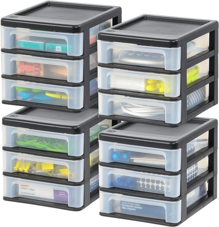 four plastic storage containers with lids and dividers on each side, stacked up against one another