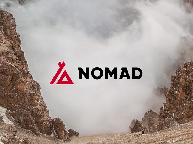 the word nomad is displayed on top of a mountain