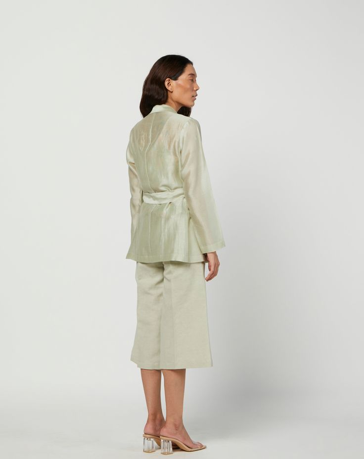 Editor's Note Featuring a green moss silk jacket in silk chanderi and s linen pants with lining. Color: Green Fabric: Silk Chanderi; Linen; Cotton Voile Lining Care: Dry Clean Only Customize Your Outfit Can't find the size you're looking for? No stress. Just select the size "Custom" while adding the item to your cart. We will follow up with you for your body measurements. To request a color or design customizations, please contact our customer care by using our "Ask us a question" form or simply Green Silk Workwear Sets, Elegant Green Silk Outerwear, Spring Silk Formal Pantsuit, Green Silk Sets For Spring, Green Silk Outerwear For Spring, Spring Silk Workwear Set, Spring Silk Pantsuit For Workwear, Silk Long Sleeve Pantsuit For Spring, Spring Silk Nehru Jacket With Long Sleeves