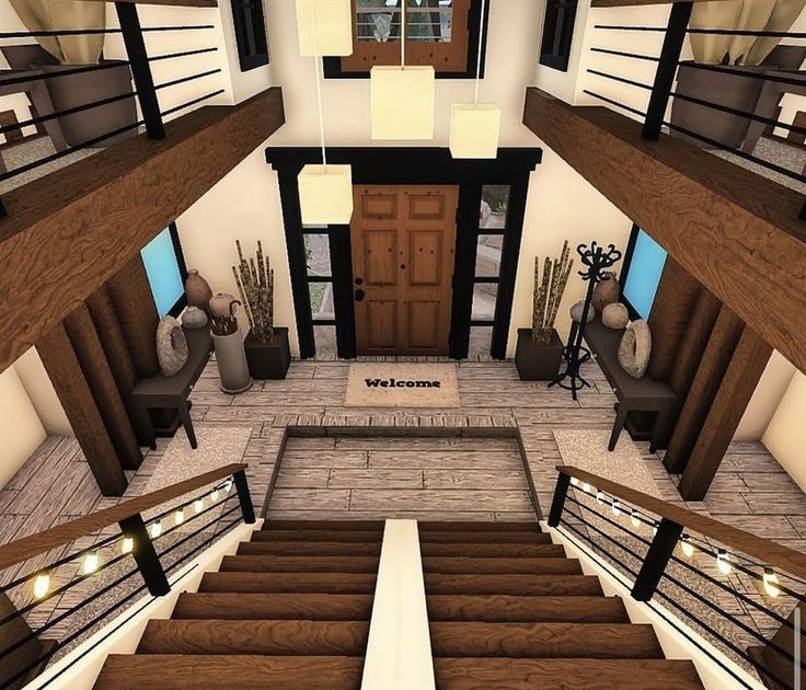 an aerial view of a living room and staircase