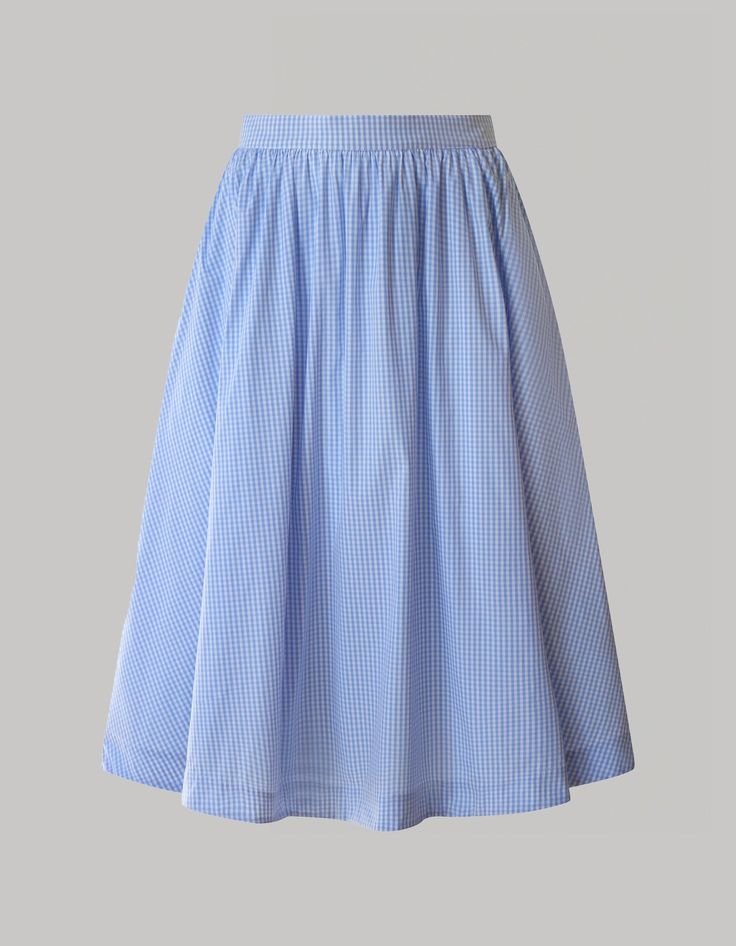 The Grace skirt is a chic and versatile wardrobe essential designed with radiant summer days in mind. Crafted from light and breathable organic cotton Vichy stretch fabric, this pale blue flowy skirt with a high waistline falls just below the knees, offering a timeless silhouette. Whether for casual or polished looks, experience comfort, and sophistication effortlessly with this stylish midi skirt. Blue Maxi Skirt For Summer Daywear, Summer Flared Maxi Skirt For Daywear, Blue Knee-length Pleated Skirt For Spring, Summer Long Pleated Skirt For Daywear, Blue Long Pleated Summer Skirt, Long Pleated Skirt For Summer Daywear, Summer Full Skirt For Daywear, Blue Gathered Skirt For Summer, Summer Daywear Pleated Skirt With Lining