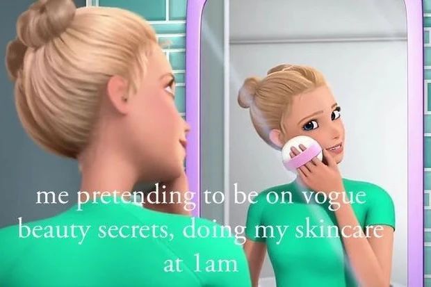 a woman brushing her teeth in front of a mirror with the caption, me pretending to be on voge beauty secrets, doing my skin care at i am