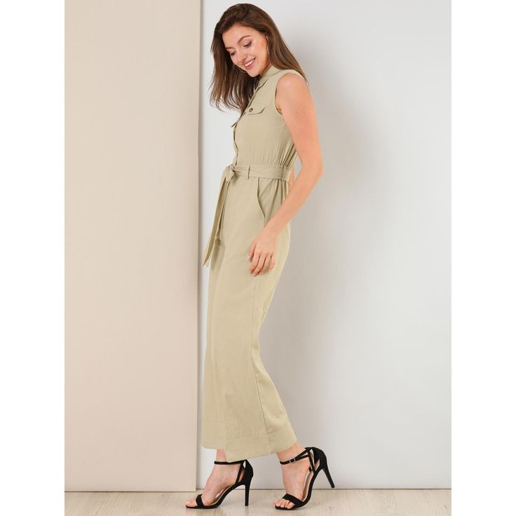 Looking cool is an easy job when you're wearing this sleeveless jumpsuit. Check off the summer trend with this khaki jumpsuit, which is cut from comfy woven cotton and fitted with slant pocket. This button up jumpsuit brings modern charm with its defining waist tie. Working nine to five just got a little more fun with this elastic back jumpsuit. Sleeveless Khaki Jumpsuit With Pockets, Sleeveless Khaki Jumpsuits And Rompers For Spring, Casual Sleeveless Belted Jumpsuits And Rompers, Sleeveless Belted Jumpsuits And Rompers, Chic Khaki Jumpsuits And Rompers With Pockets, Beige Sleeveless Jumpsuit For Work, Khaki Sleeveless Jumpsuits For Work, Sleeveless Beige Jumpsuit For Work, Sleeveless Khaki Jumpsuits For Work