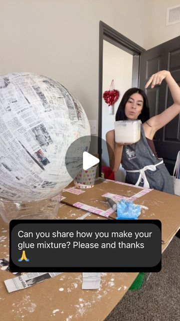 two women sitting at a table in front of a giant paper ball with the words can you share how you make your glue mixture? please and thanks