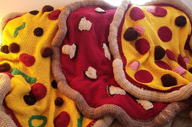 a pile of blankets that have been made to look like pizzas