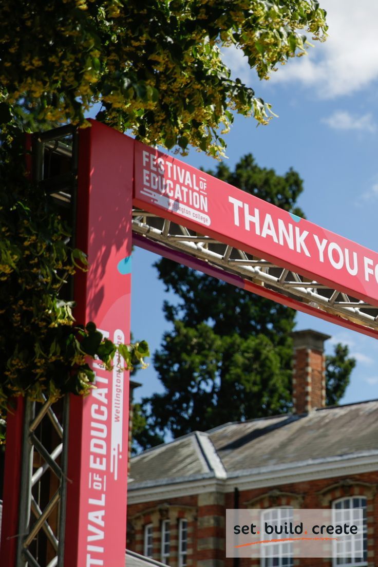 a red sign that says festival education and thank you for it