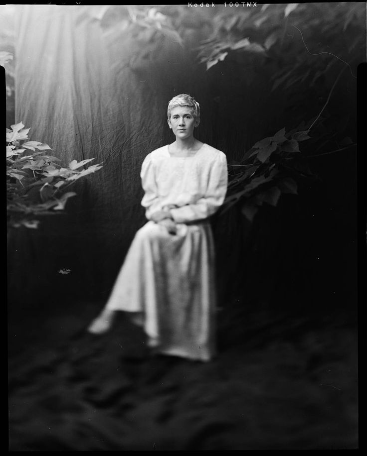 an old black and white photo of a woman