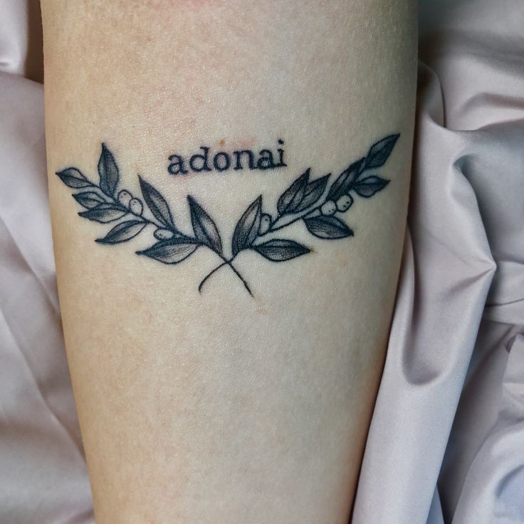 a tattoo with the word adona on it