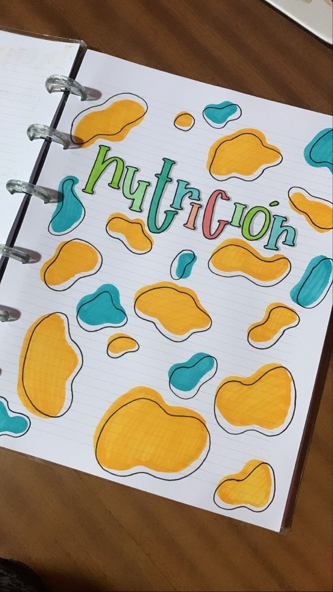 an open notebook with the word nutricon written in green and yellow on it