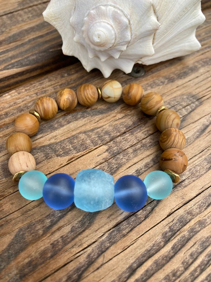 Beachy Sea Glass Bracelet Ocean Blues Sea Glass Beads Jasper stone beads with wavy Brass spacer beads Size 7 inches Blue Beaded Bracelets With 8mm Beads For Beach, Spiritual Stretch Bracelet With Large Beads For Beach, Spiritual Beaded Bracelets With Large Beads For Beach, Spiritual Large Beaded Bracelets For Beach, Spiritual Blue Beaded Bracelets For Beach, Beaded Glass Bracelets For Beach, Czech Glass Large Beads For Beach, Turquoise Beaded Bracelets With 8mm Beads For Beach, Blue Spiritual Stretch Bracelet For Beach