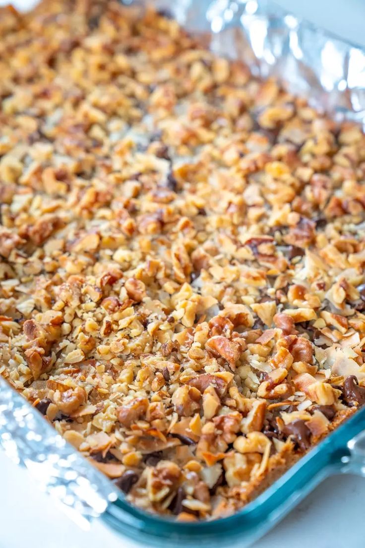 a casserole dish filled with nuts and other toppings