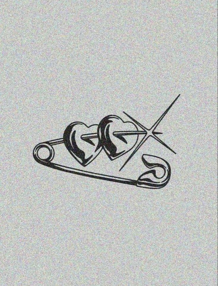 a pair of scissors with two hearts cut in half on top of each other,