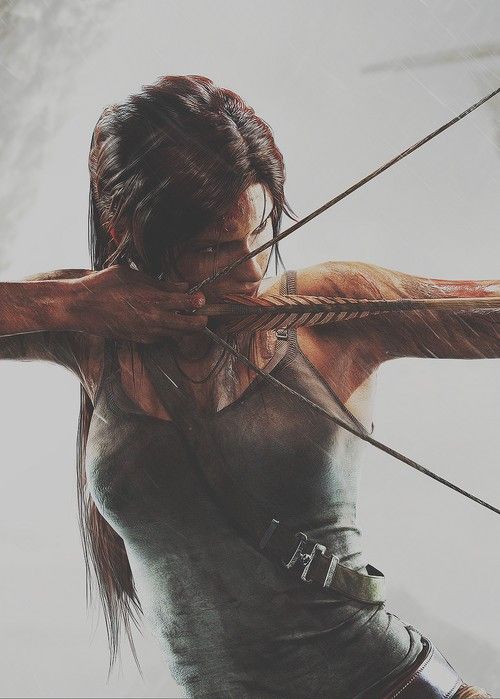 an image of a woman holding a bow and arrow in the air with her hands behind her back