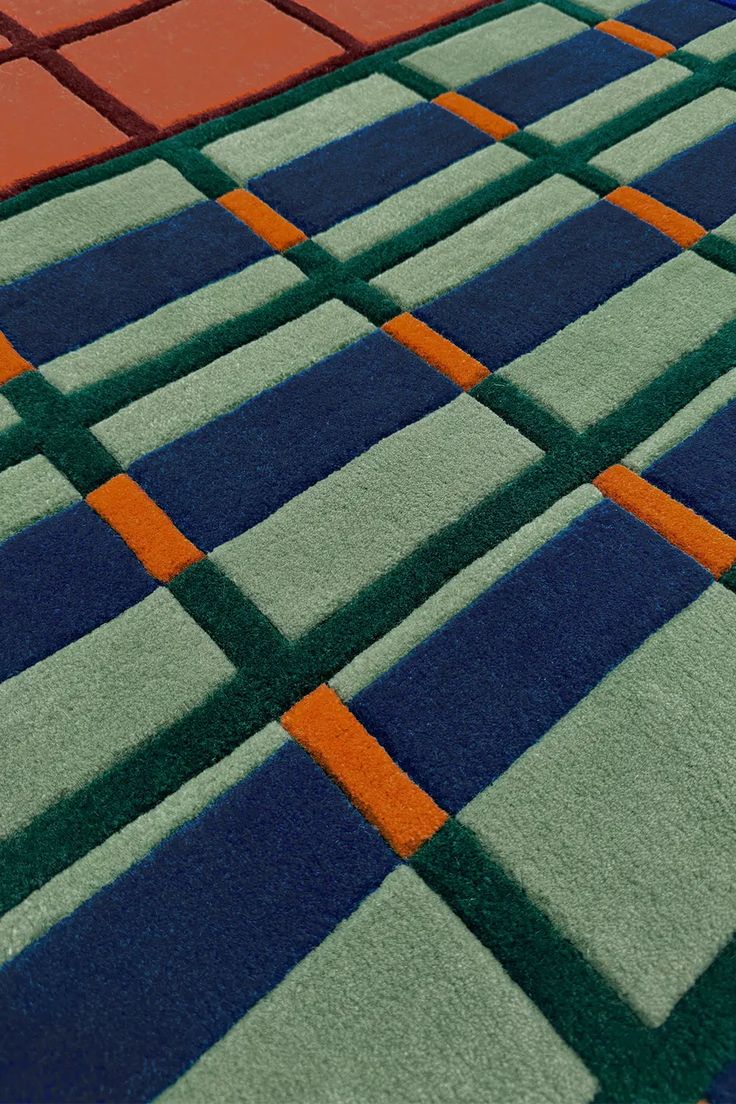 an area rug with different colored squares on it