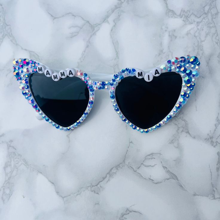 The perfect statement accessory for anything abba themed!  Mamma Mia, here we go again! Abba Voyagr or an Abba themed birthday party! Make a statement in these sparkly Greek blue sunglasses!  Other variations available in my Etsy shop and they can be personalised with any wording if your choice! Mamma Mia Party Accessories, Mamma Mia Activities, Mamma Mia Party Activities, Fun Blue Sunglasses For Party, Fun Blue Sunglasses For Parties, Playful Blue Sunglasses For Party, Playful Blue Party Sunglasses, Party Sunglasses With Mirrored Lenses, Party Sunglasses With Mirrored Glass Lenses