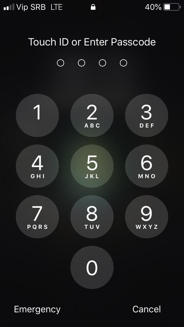 an iphone screen with the text enter passcode on it and numbers in front of it