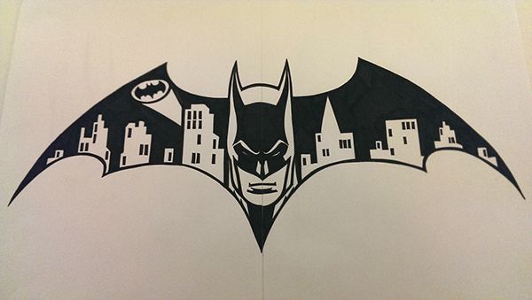 a drawing of the batman symbol in black and white