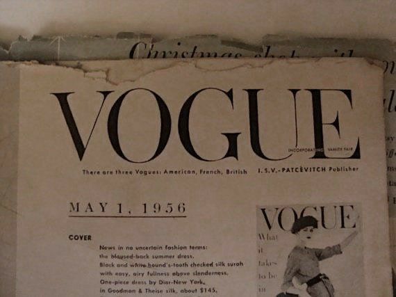 an old fashion magazine is displayed on the wall