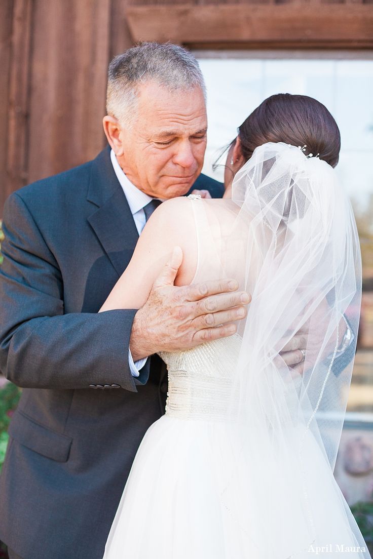 an older man and woman embracing each other