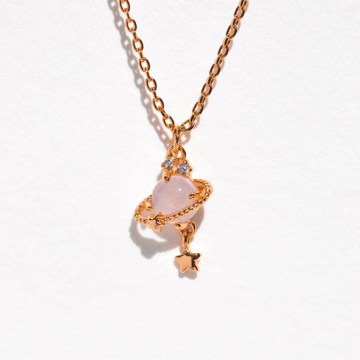 You'll have drops of Jupiter in your hair while wearing this beautiful necklace! Shop this best selling design now. Trendy Pendant Charm Necklace For Her, Trendy Pendant Charm Necklaces For Her, Trendy Pendant Charm Necklace Gift For Her, Trendy Pendant Charm Necklaces As Gift For Her, Rose Gold Crystal Necklace With Clavicle Chain, Rose Gold Clavicle Chain Crystal Necklace, Trendy Crystal Clavicle Chain Necklace For Gifts, Trendy Clavicle Chain Charm Necklace As Gift For Her, Trendy Pink Sterling Silver Necklaces