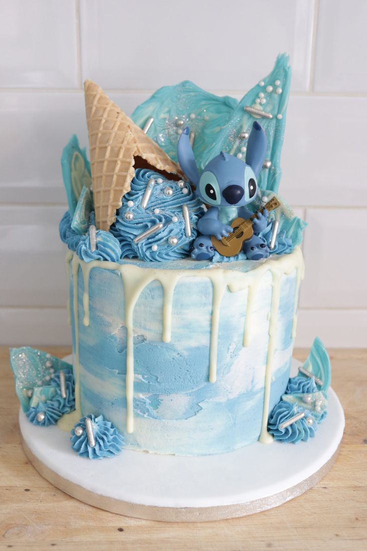 a cake decorated with blue icing and decorations