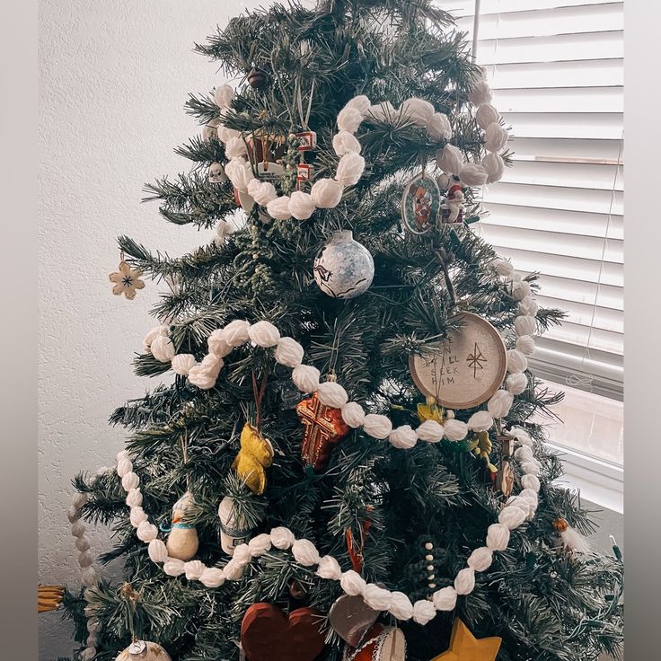 a small christmas tree with ornaments on it