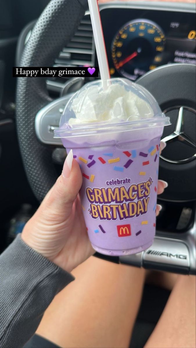 a person holding up a cup of ice cream in their hand with the words happy birthday grace on it