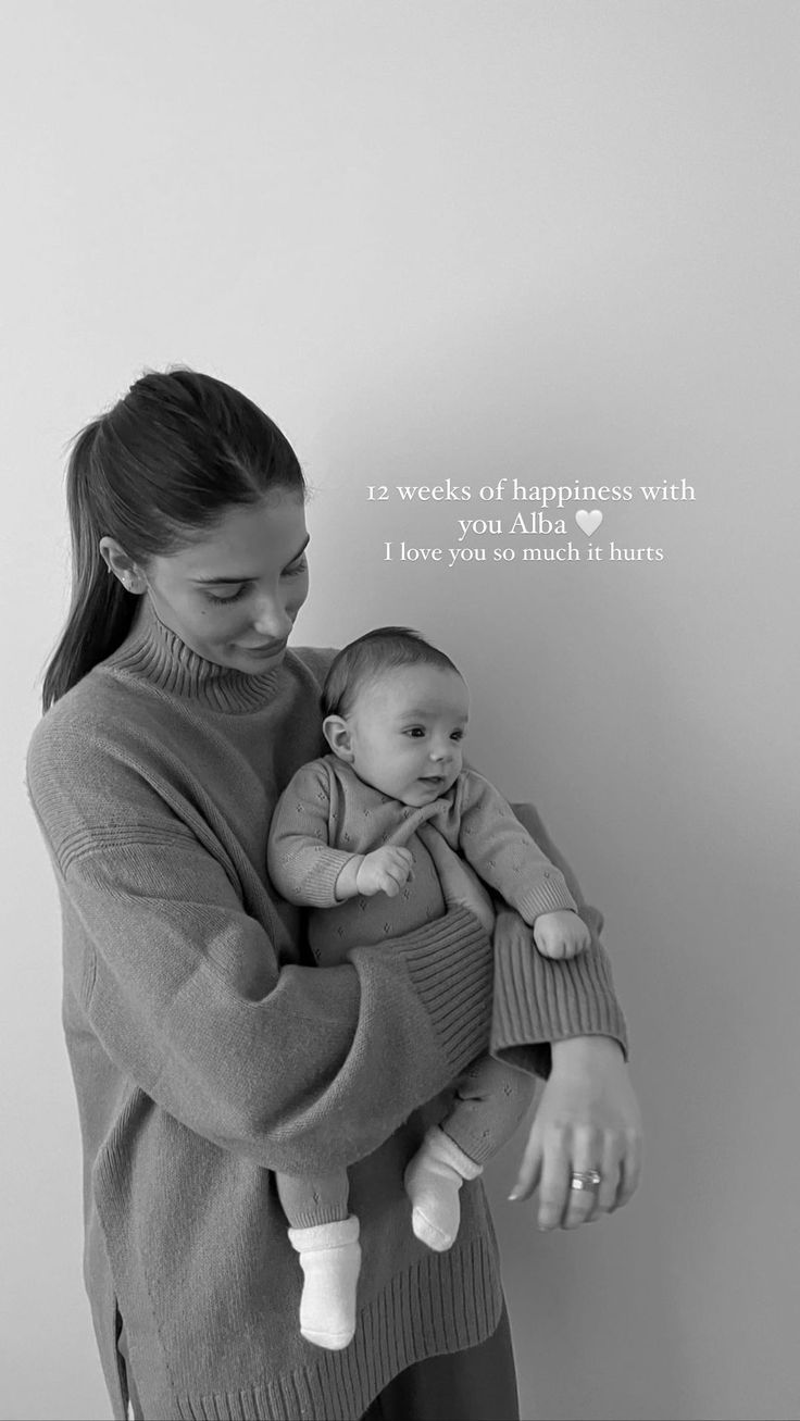 a woman holding a baby in her arms with the caption, i love you so much