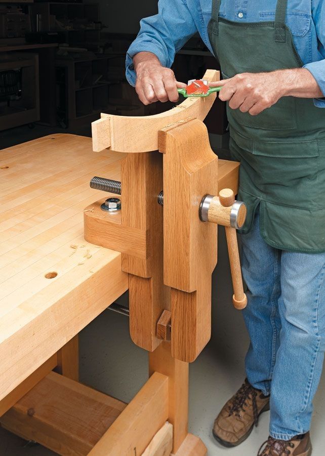 a man is working with woodworking tools