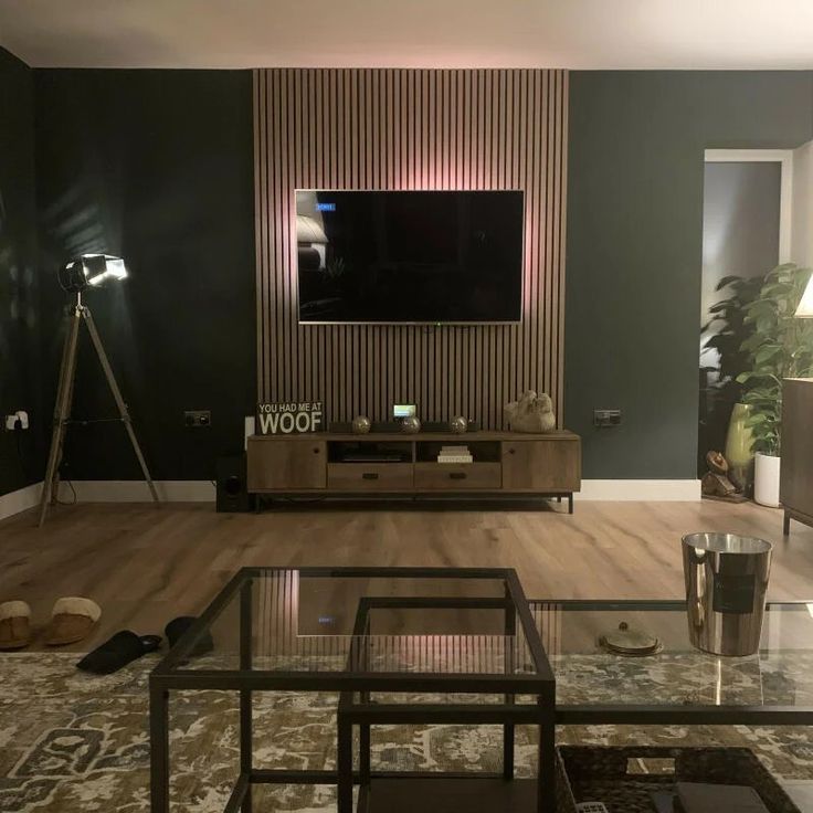 a living room filled with furniture and a flat screen tv