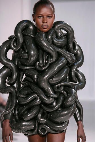 an image of a woman with large black snakes on her head and the caption says, trying to kinky you're doing it wrong