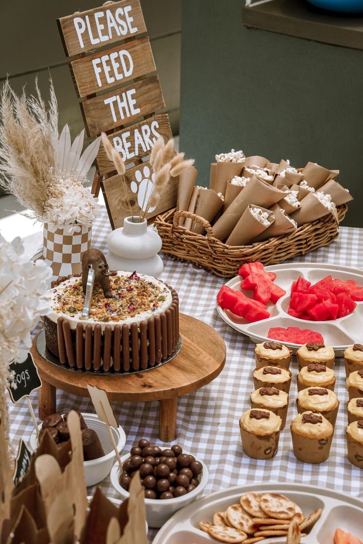 a table topped with lots of desserts and pastries