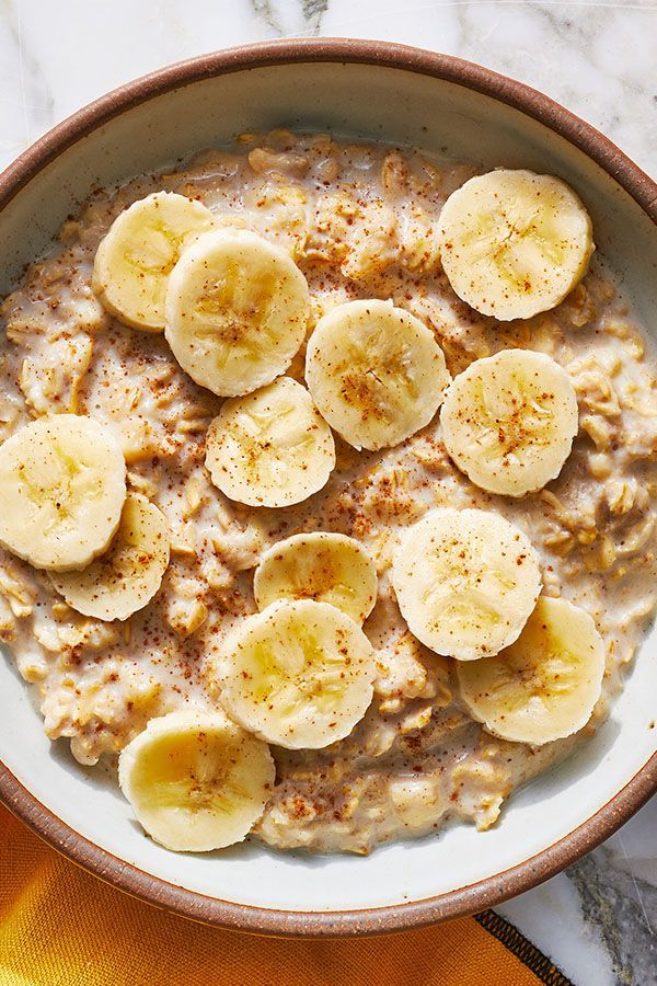 a bowl filled with oatmeal topped with bananas