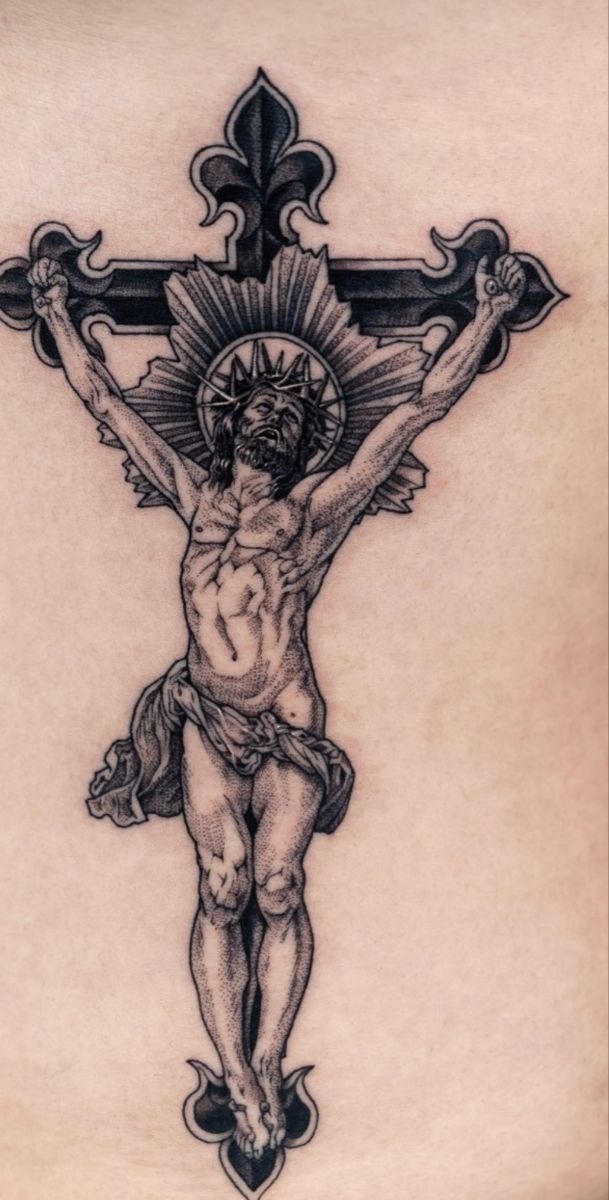 a cross tattoo on the back of a man