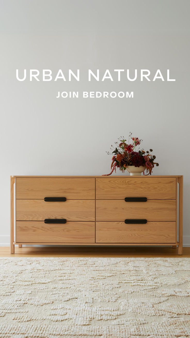 a wooden dresser sitting in front of a white wall with the words urban natural on it