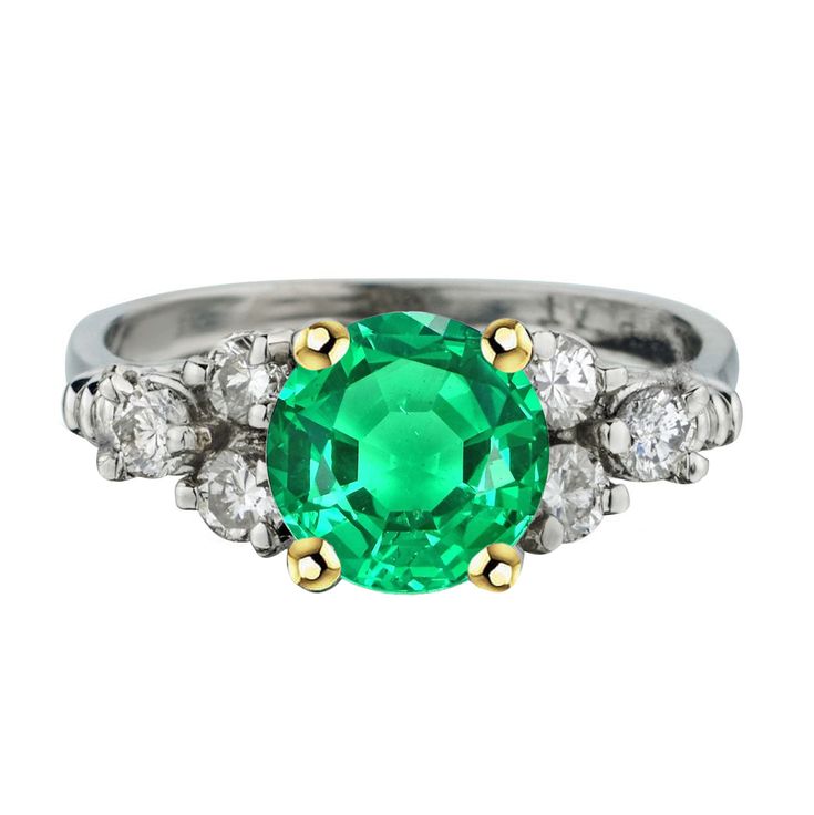 METAL SPECIFICATIONS Two Tone Gold 14K STONE SPECIFICATIONS Stone Name : Green Emerald and Diamond Stone Cut : Round Cut Stone Details : There is one round cut green emerald stone in the center approx. 3 carats (Approx. Dia. 8.5 mm) with approx. 2 carats of round cut diamonds on the sides. Crafted with natural earth mined stones. Color : Green/F Clarity : VS1 Quality : AAA Total : Approx. 5 Carats RING SPECIFICATIONS Size : 6.5 (Can ship in any size) Appraised Value : $14,148.00 Comes with Certificate Luxury Green Round Crystal Ring, Luxury Emerald Gemstones With Accent Stones, Elegant Green Diamond Gemstones, Classic Green Multi-stone Diamond Ring, Luxury Tsavorite Emerald Ring, Timeless Green Diamond Round Ring, Elegant Green Emerald Ring With Round Band, Green Diamond Ring With Round Band, Timeless Green Round Band Jewelry